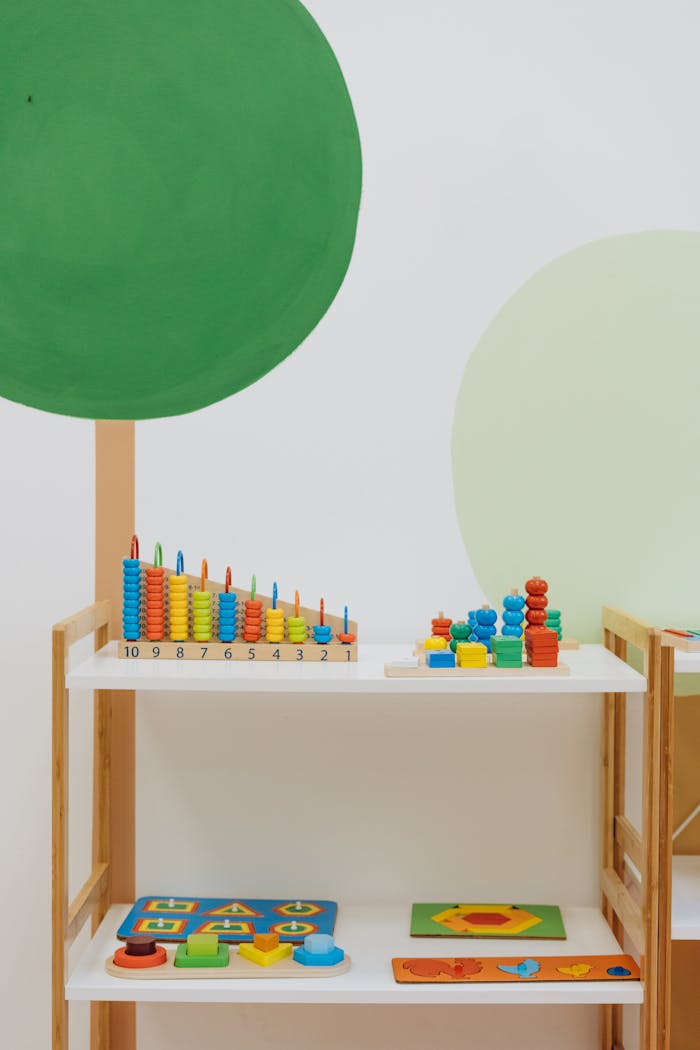 about-us A well-organized indoor playroom filled with colorful educational toys for preschool children.